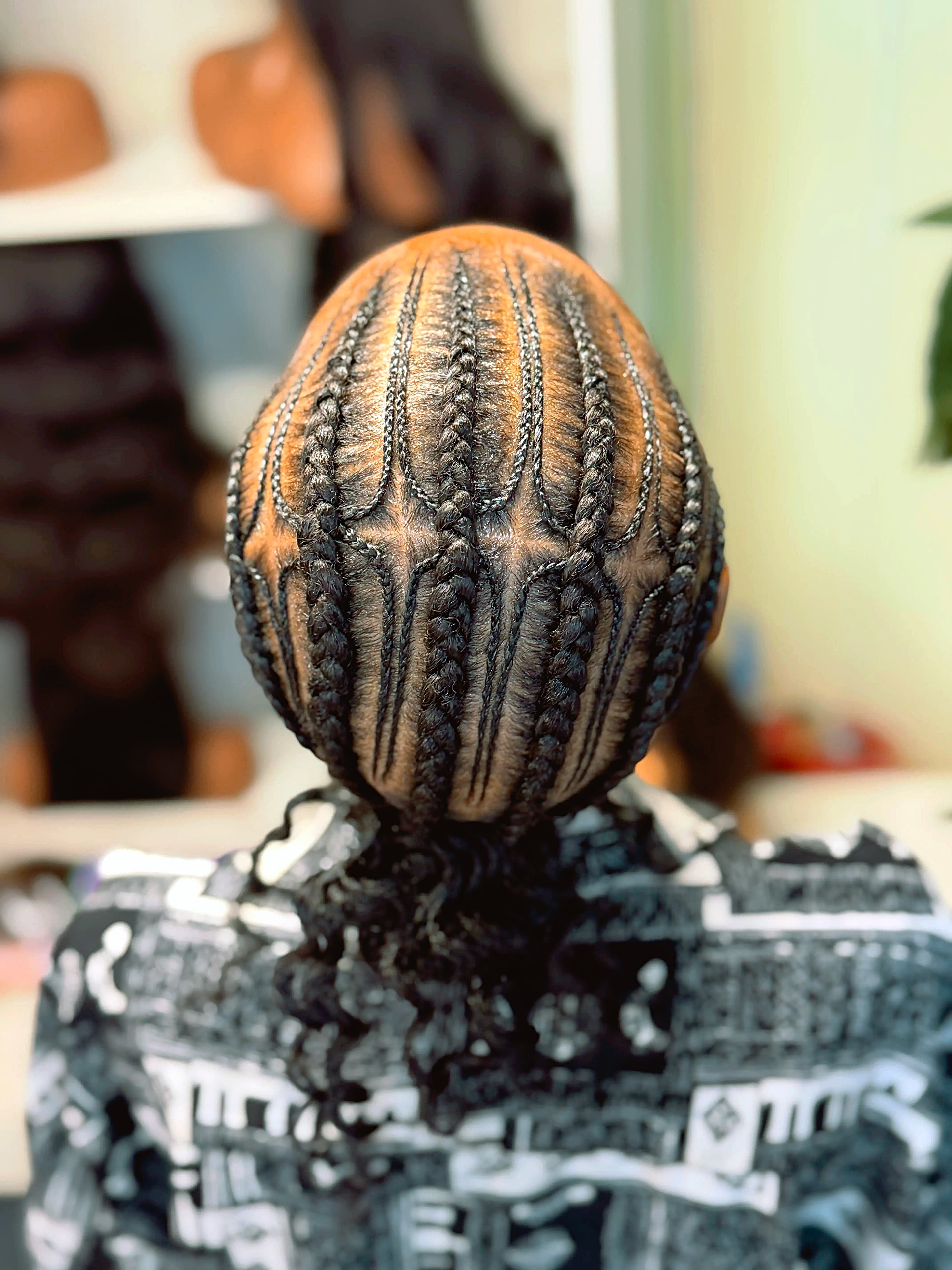 Geometric Dome Cornrows — Cornrows & feed-in braids at Qasr Alshar Salon, Dubai — crisp, precise lines near Union Metro, Deira.