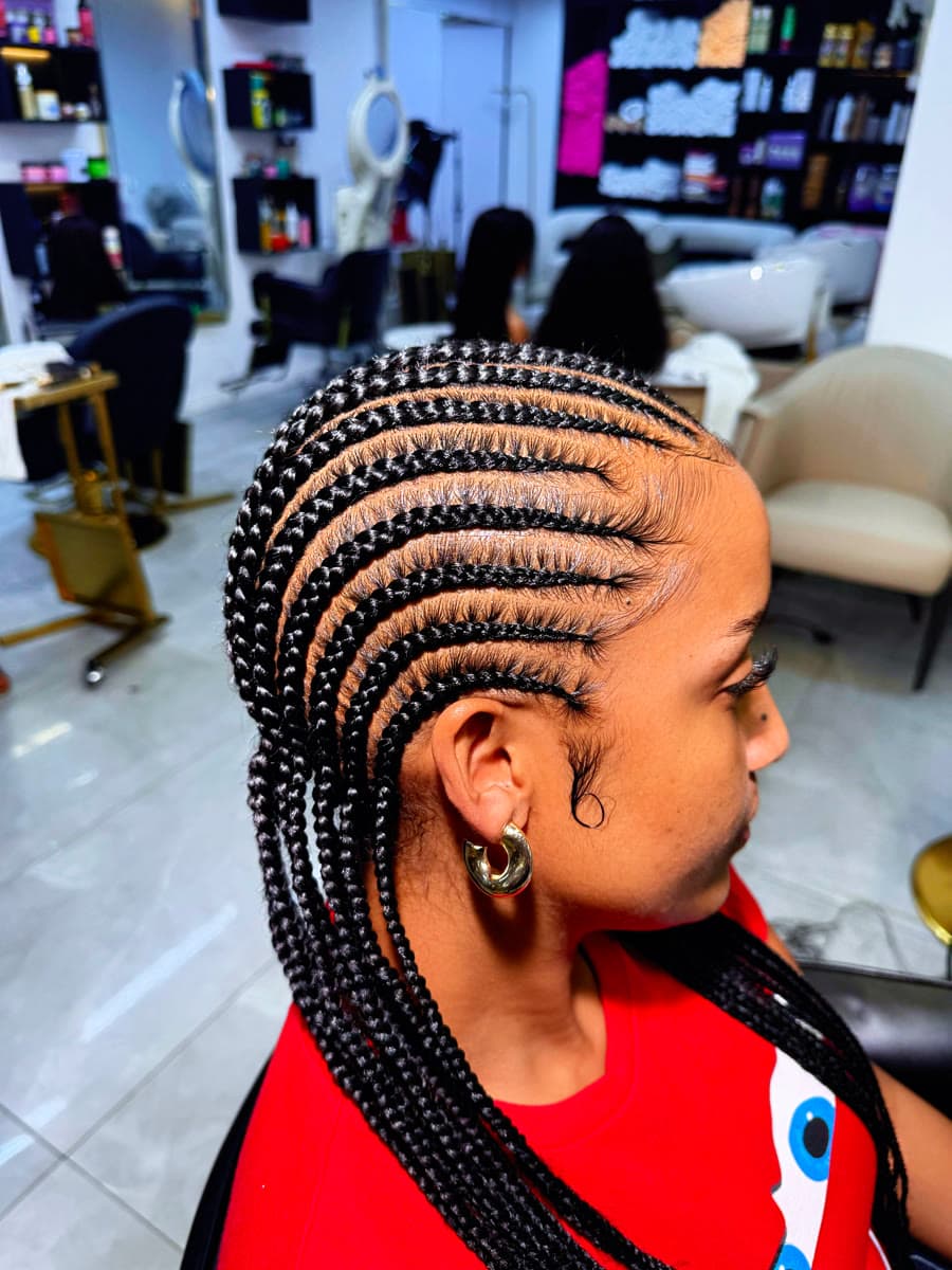 Sleek Side Cornrows — Cornrows & feed-in braids at Qasr Alshar Salon, Dubai — crisp, precise lines near Union Metro, Deira.
