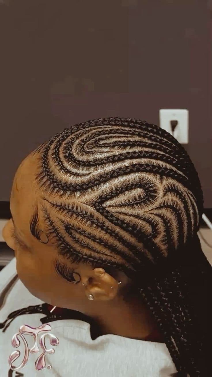 Swirl Cornrow Top View — Cornrows & feed-in braids at Qasr Alshar Salon, Dubai — crisp, precise lines near Union Metro, Deira.