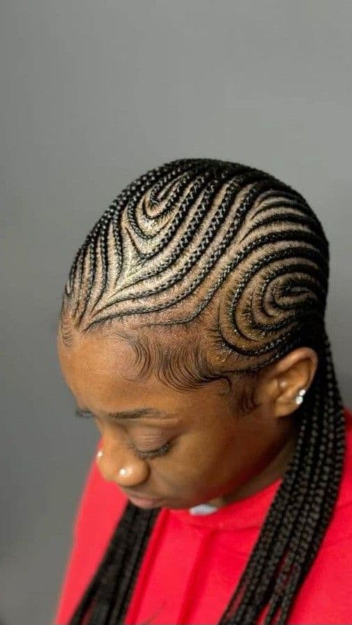 Geometric Swirl Cornrows — Cornrows & feed-in braids at Qasr Alshar Salon, Dubai — crisp, precise lines near Union Metro, Deira.